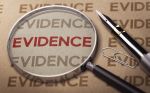 Magnifying glass over the word evidence - evidence federal court concept