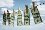 Hundred dollar bills hanging from a clothesline concept